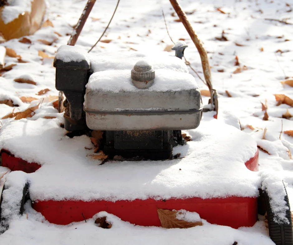 A lawn and mower covered in snow
