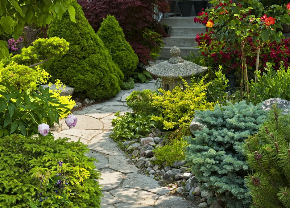 A garden path with stone and mulch landscaping
